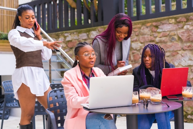 Young businesswomen of black ethnicity In a business meeting in a cafeteria