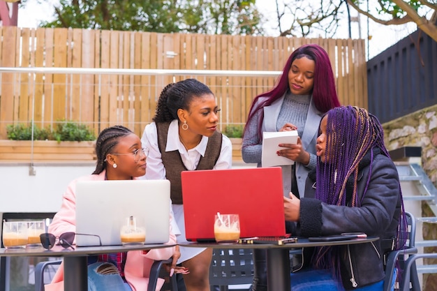 Young businesswomen of black ethnicity In a business meeting in a cafeteria