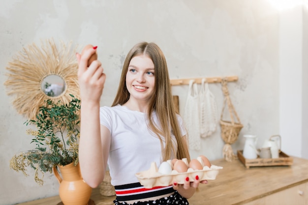 Young casual woman in the kitchen