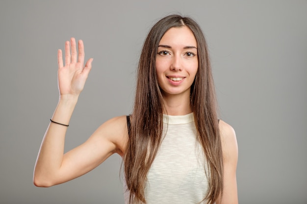 Young casual woman making gesture