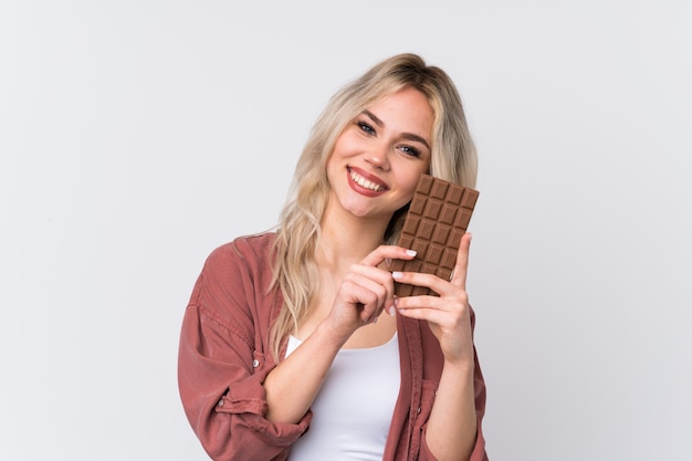 Young caucasian beauty woman over isolated white wall