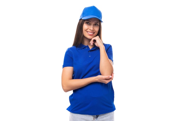 Young caucasian brunette woman in blank blue tshirt and cap