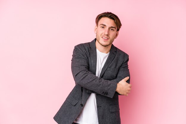 Young caucasian business man posing isolated who feels confident, crossing arms with determination.