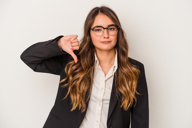 Young caucasian business woman isolated on white background showing a dislike gesture, thumbs down. Disagreement concept.