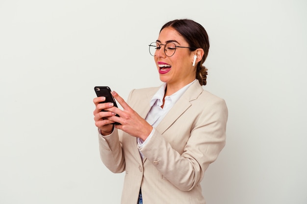 Young caucasian business woman typing a message with mobile phone