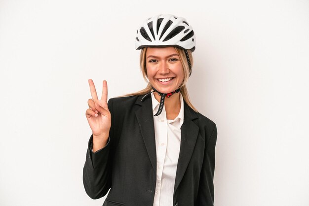 Young caucasian business woman wearing a bike helmet isolated on white background showing number two with fingers.