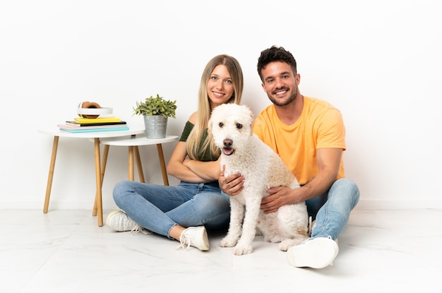 Young caucasian couple with dog