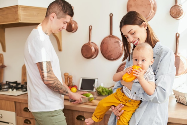 Young caucasian family with a little cute son in the morning