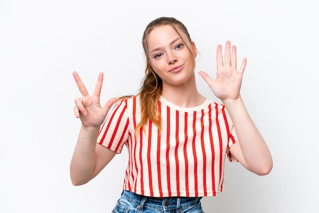 Young caucasian girl isolated on white background counting eight with fingers