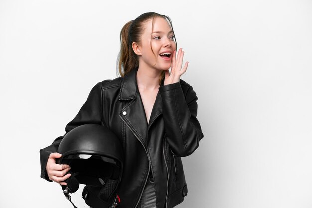 Young caucasian girl with a motorcycle helmet