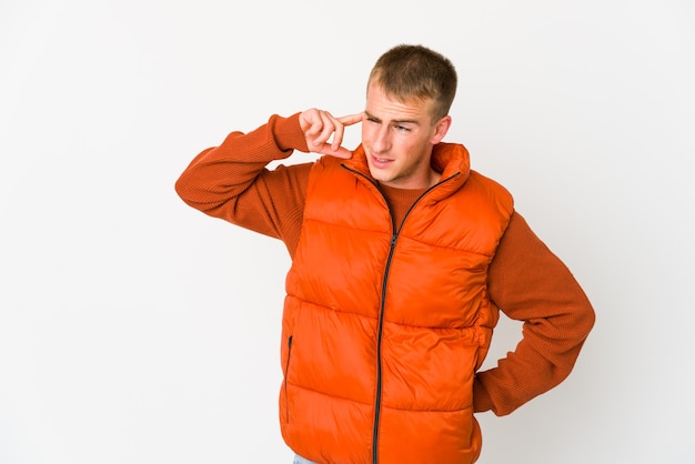 Young caucasian handsome man covering ears with hands.