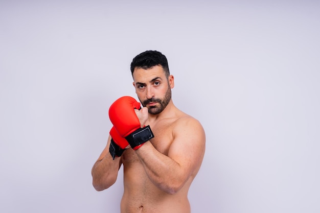 Young caucasian handsome man isolated on white background with boxing gloves