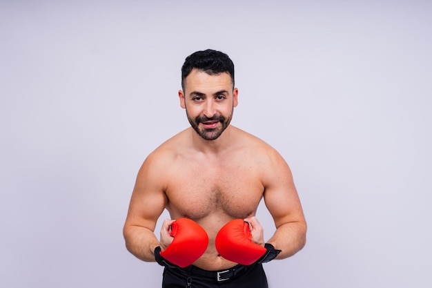 Young caucasian handsome man isolated on white background with boxing gloves