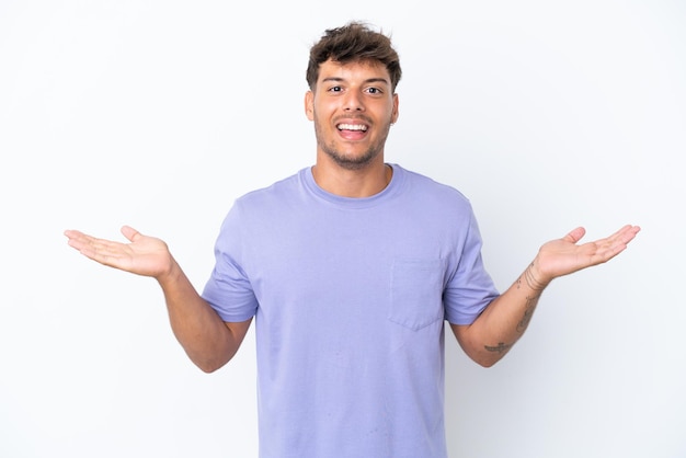 Young caucasian handsome man isolated on white background with shocked facial expression