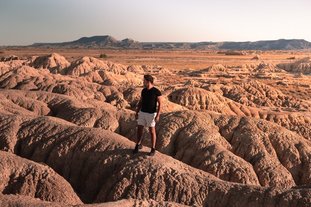 Young caucasian man at Bardenas Reales, Navarra, Basque Country.