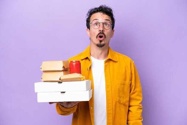 Young caucasian man over isolated background