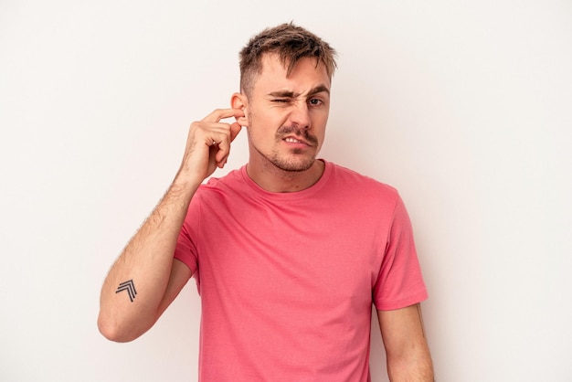 Young caucasian man isolated on white background celebrating a victory or success, he is surprised and shocked.