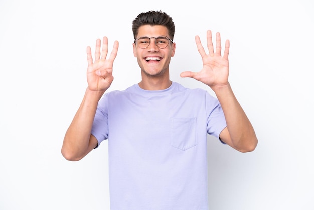 Young caucasian man isolated on white background counting nine with fingers