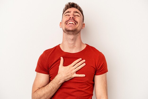 Young caucasian man isolated on white background doing a denial gesture