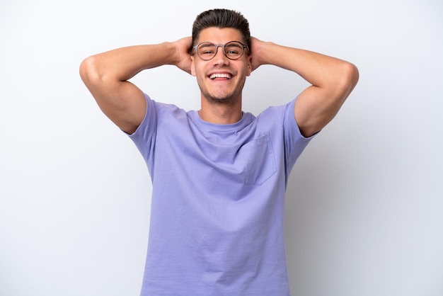 Young caucasian man isolated on white background laughing