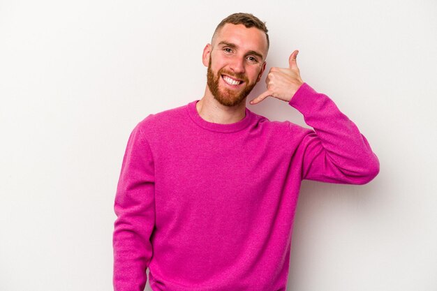 Young caucasian man isolated on white background showing a mobile phone call gesture with fingers