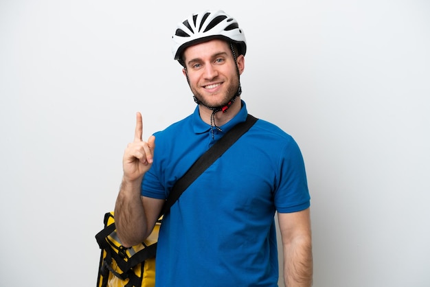 Young caucasian man with thermal backpack isolated on white background showing and lifting a finger in sign of the best