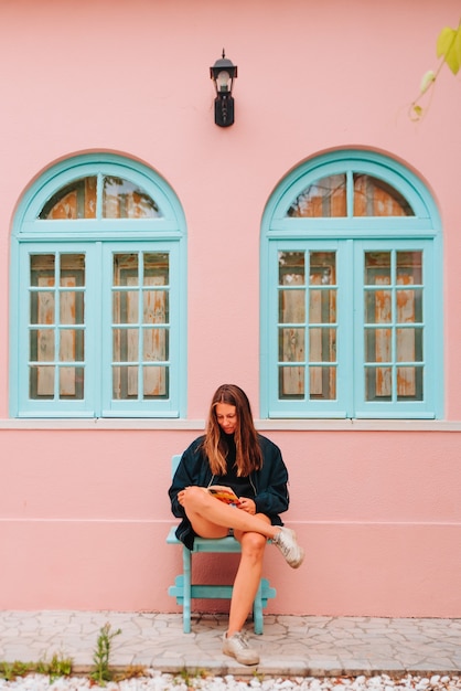 Young caucasian northern european woman sitting while reading a book