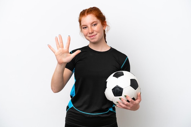 Young caucasian reddish football player woman isolated on white background counting five with fingers