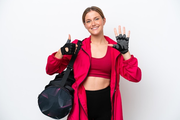 Young caucasian sport woman isolated on white background counting six with fingers