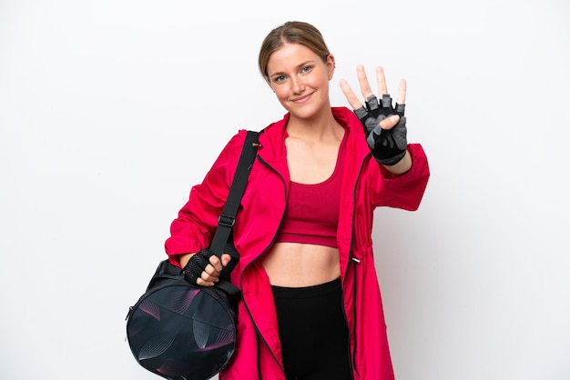 Young caucasian sport woman isolated on white background happy and counting four with fingers