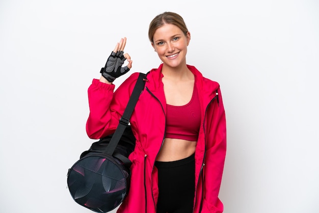 Young caucasian sport woman isolated on white background showing ok sign with fingers