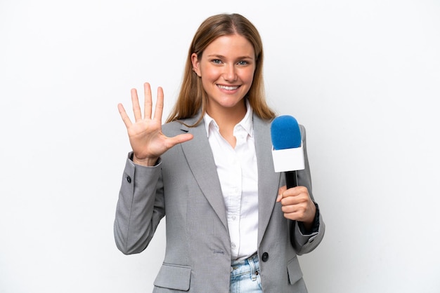 Young caucasian tv presenter woman isolated on white background counting five with fingers