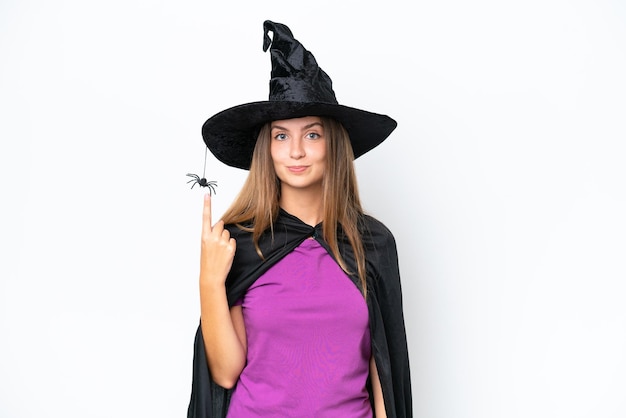 Young caucasian woman costume as witch isolated on white background pointing with the index finger a great idea