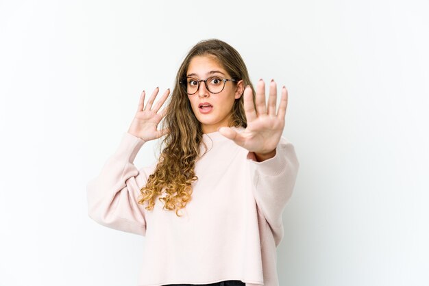 Young caucasian woman expressing emotions isolated