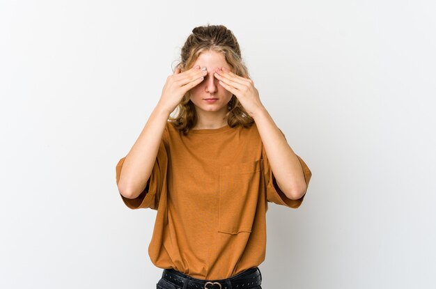 Photo young caucasian woman having a head ache, touching front of the face.