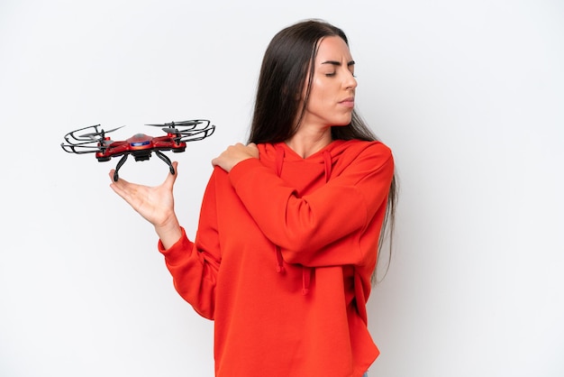 Young caucasian woman holding a drone isolated on white background