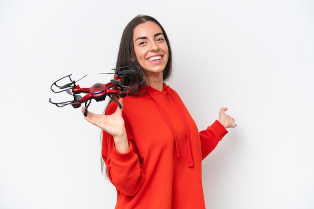 Young caucasian woman holding a drone