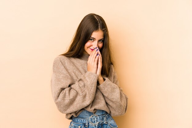 Young caucasian woman isolated on beige making up plan in mind, setting up an idea.