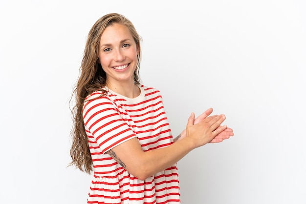 Young caucasian woman isolated on white background applauding