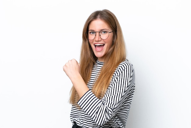 Young caucasian woman isolated on white background celebrating a victory