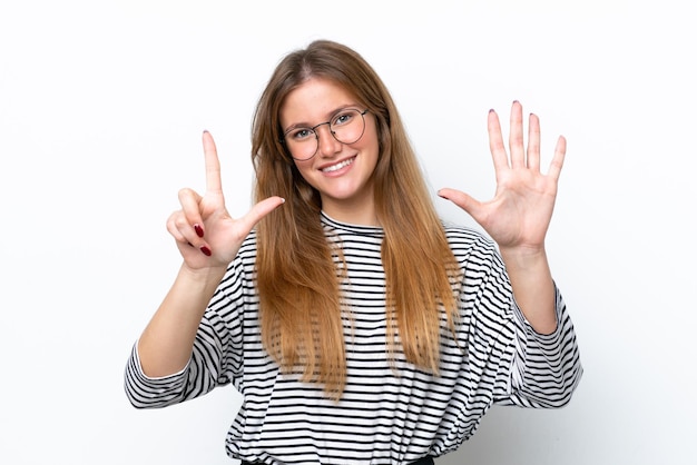 Young caucasian woman isolated on white background counting seven with fingers