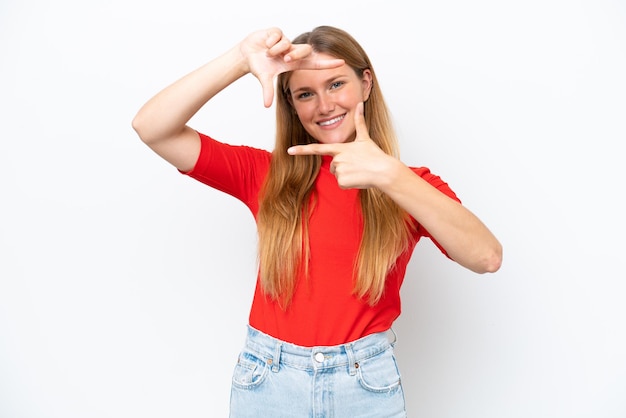 Young caucasian woman isolated on white background focusing face Framing symbol