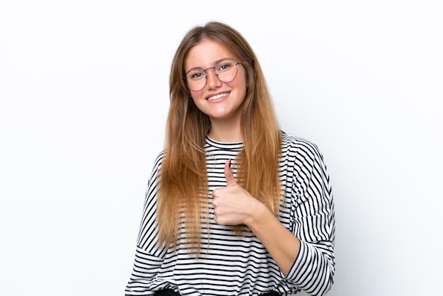 Young caucasian woman isolated on white background giving a thumbs up gesture