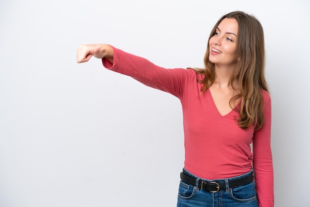 Young caucasian woman isolated on white background giving a thumbs up gesture