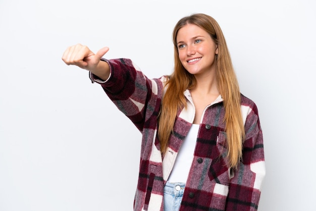 Young caucasian woman isolated on white background giving a thumbs up gesture