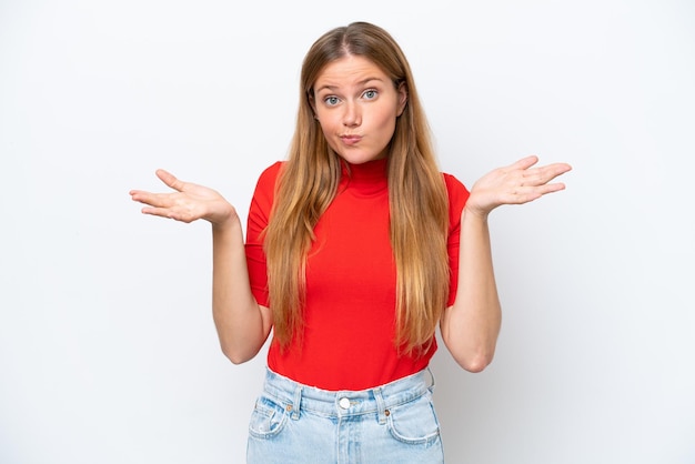 Young caucasian woman isolated on white background having doubts while raising hands