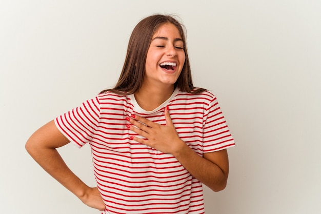 Young caucasian woman isolated on white background joyful laughing a lot. Happiness concept.