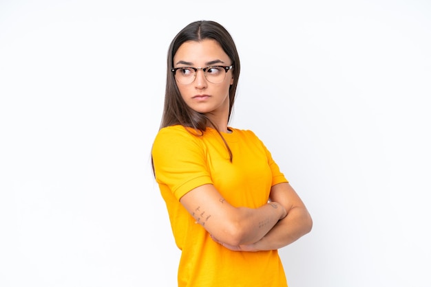 Young caucasian woman isolated on white background keeping the arms crossed