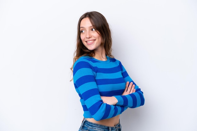 Young caucasian woman isolated on white background looking to the side and smiling