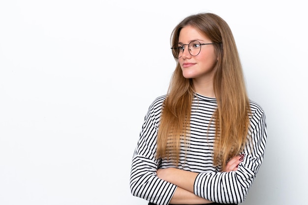 Young caucasian woman isolated on white background looking to the side